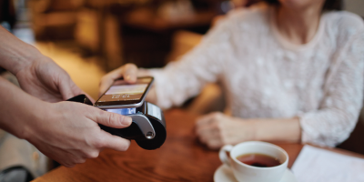 woman using tap-to-pay